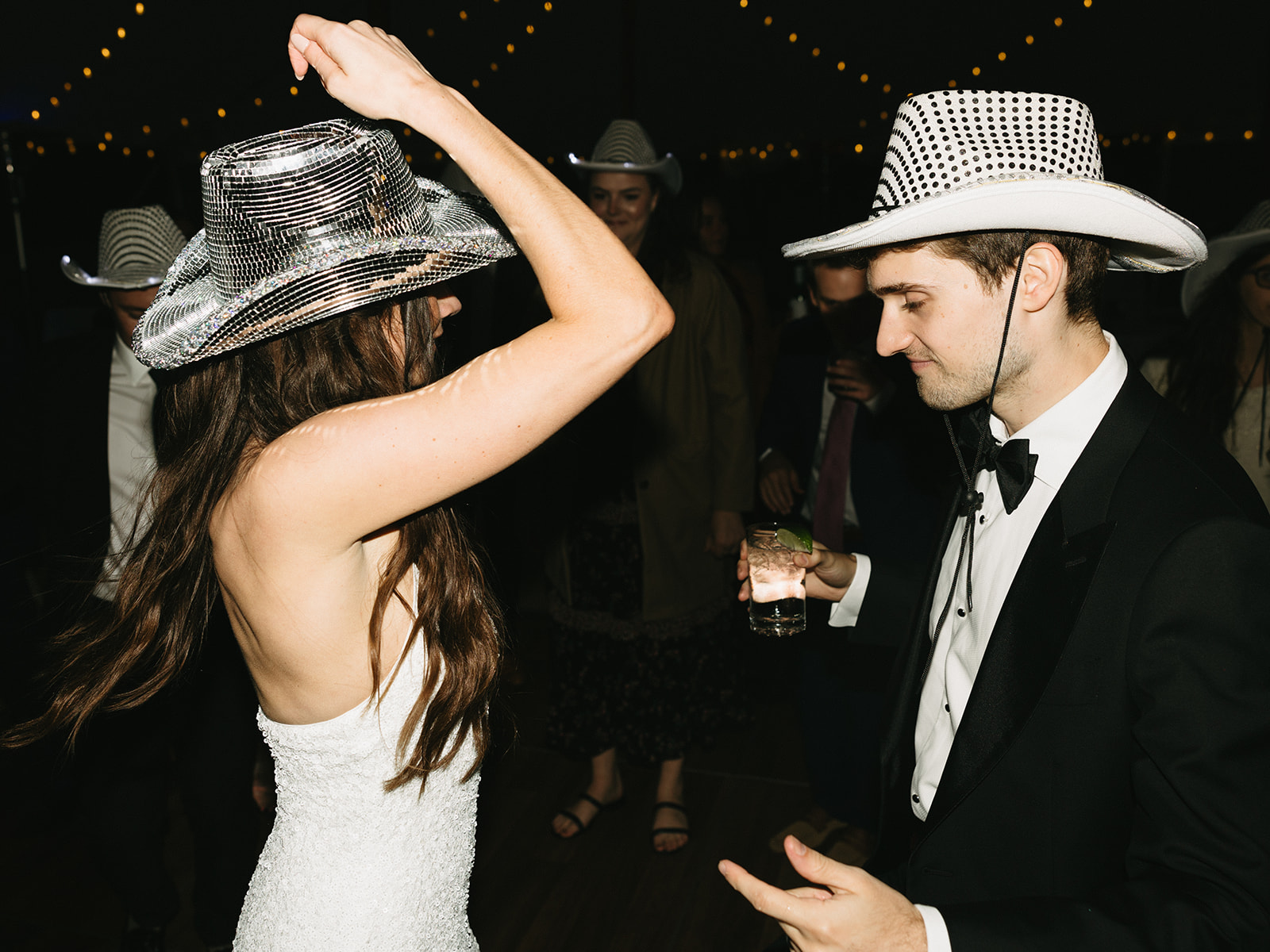 wedding weekend reception dancing photos disco cowboy hats