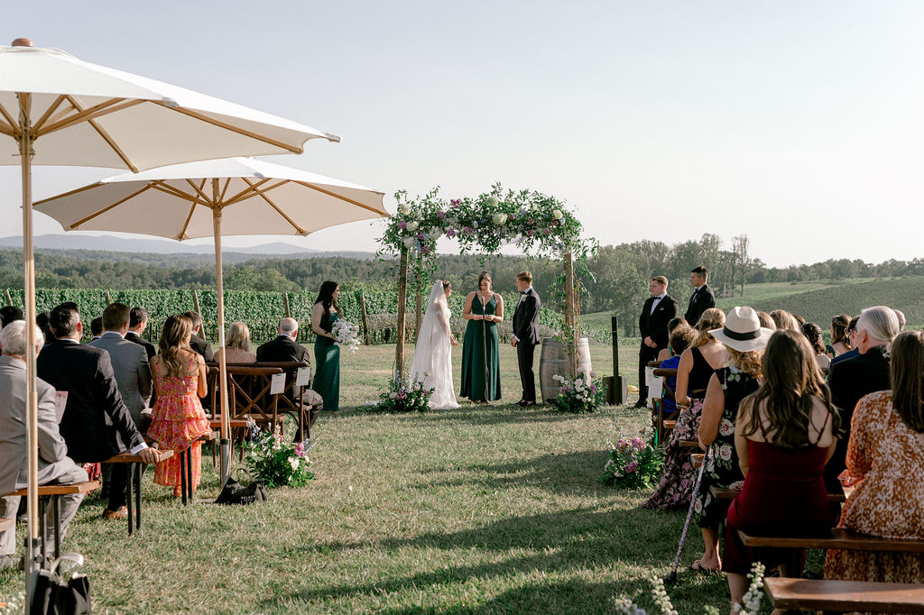 umbrellas during summer wedding ceremony
